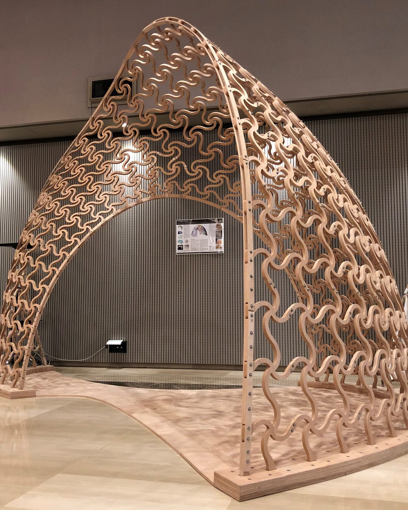 FlexMaps Pavilion: a twisted timber arc assembled from flat, flexible mesostructured panels